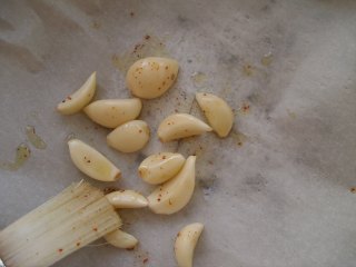 Garlic cloves lightly brushed with olive oil