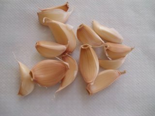 Unpeeled garlic cloves prepared for roasting